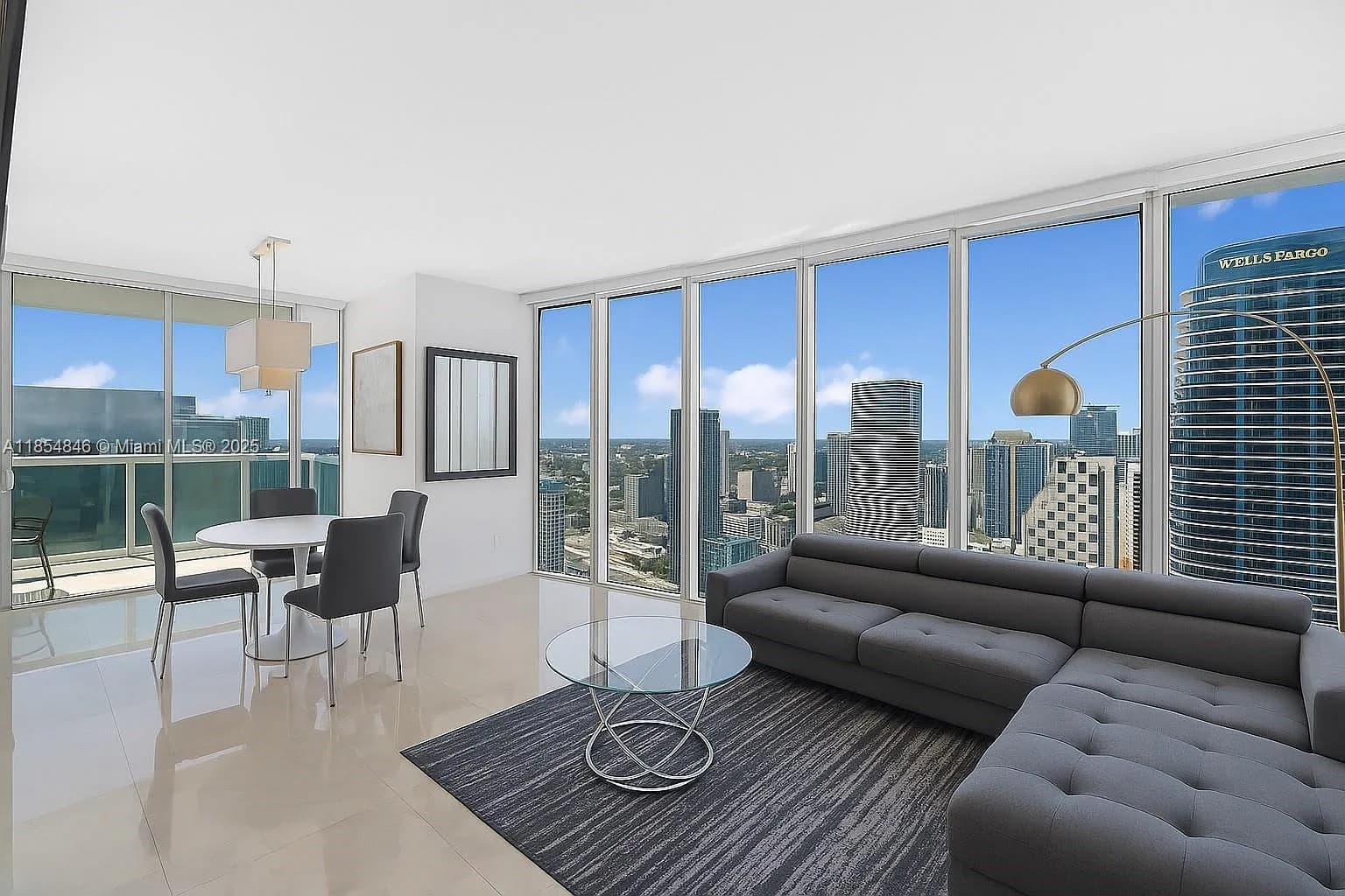 Bright, open-concept living area with breathtaking skyline views.