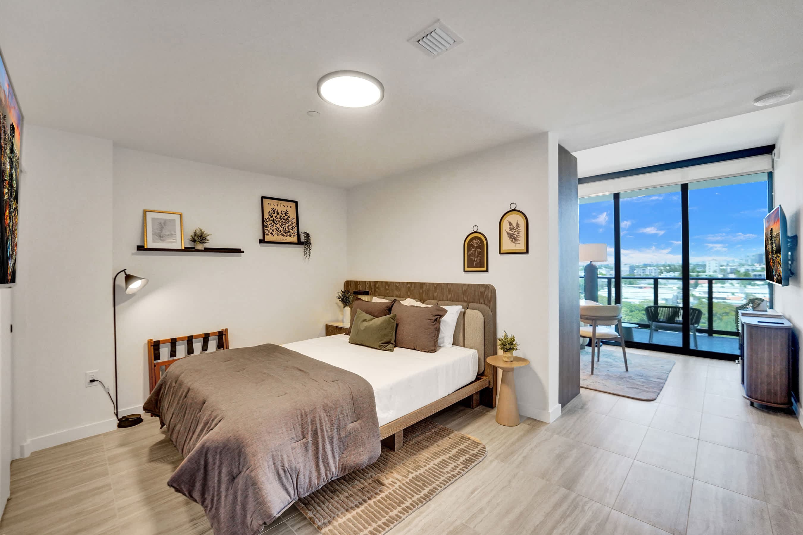 Serene master bedroom with direct balcony access.