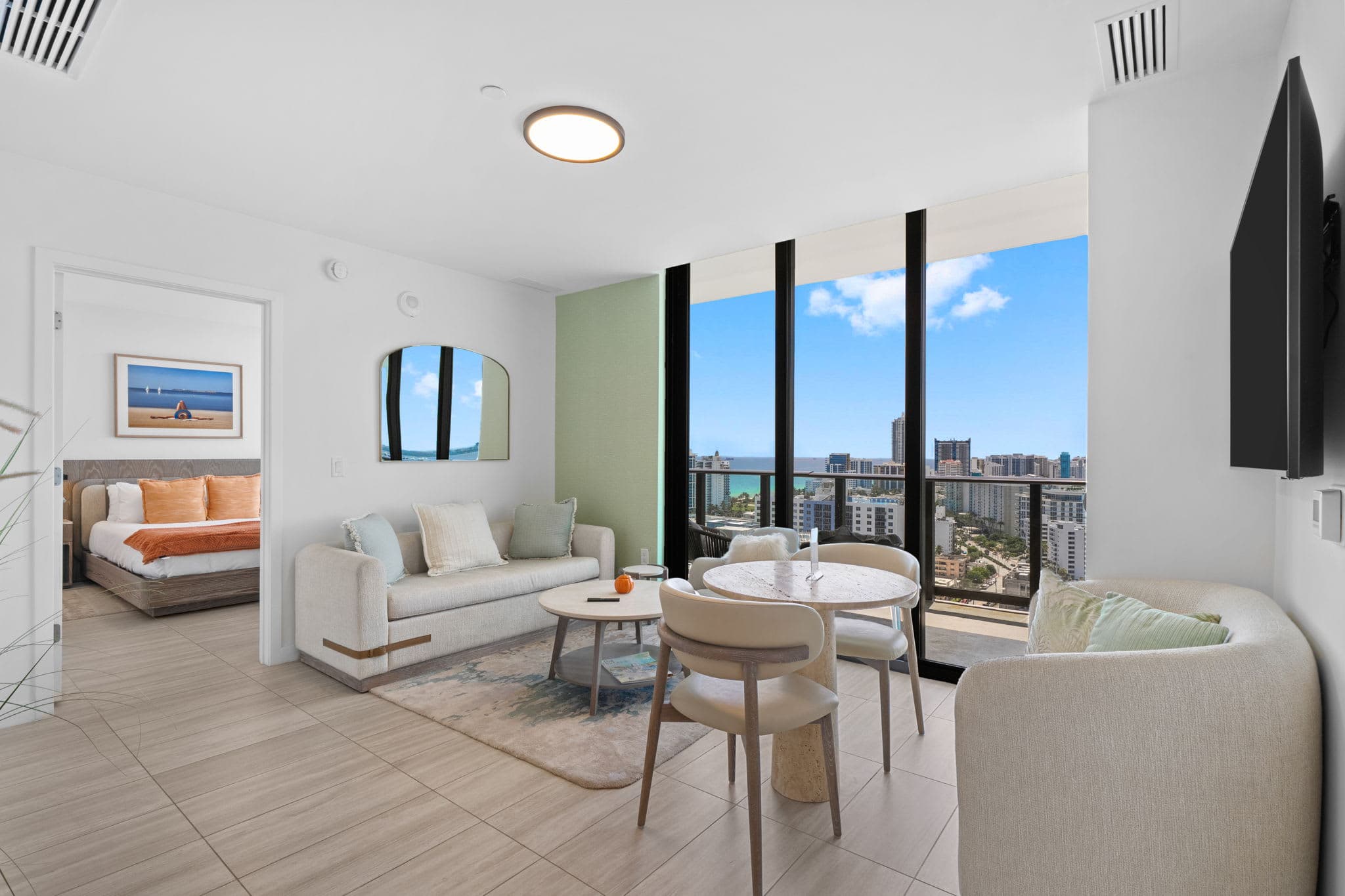 Bright living and dining area beside the balcony.